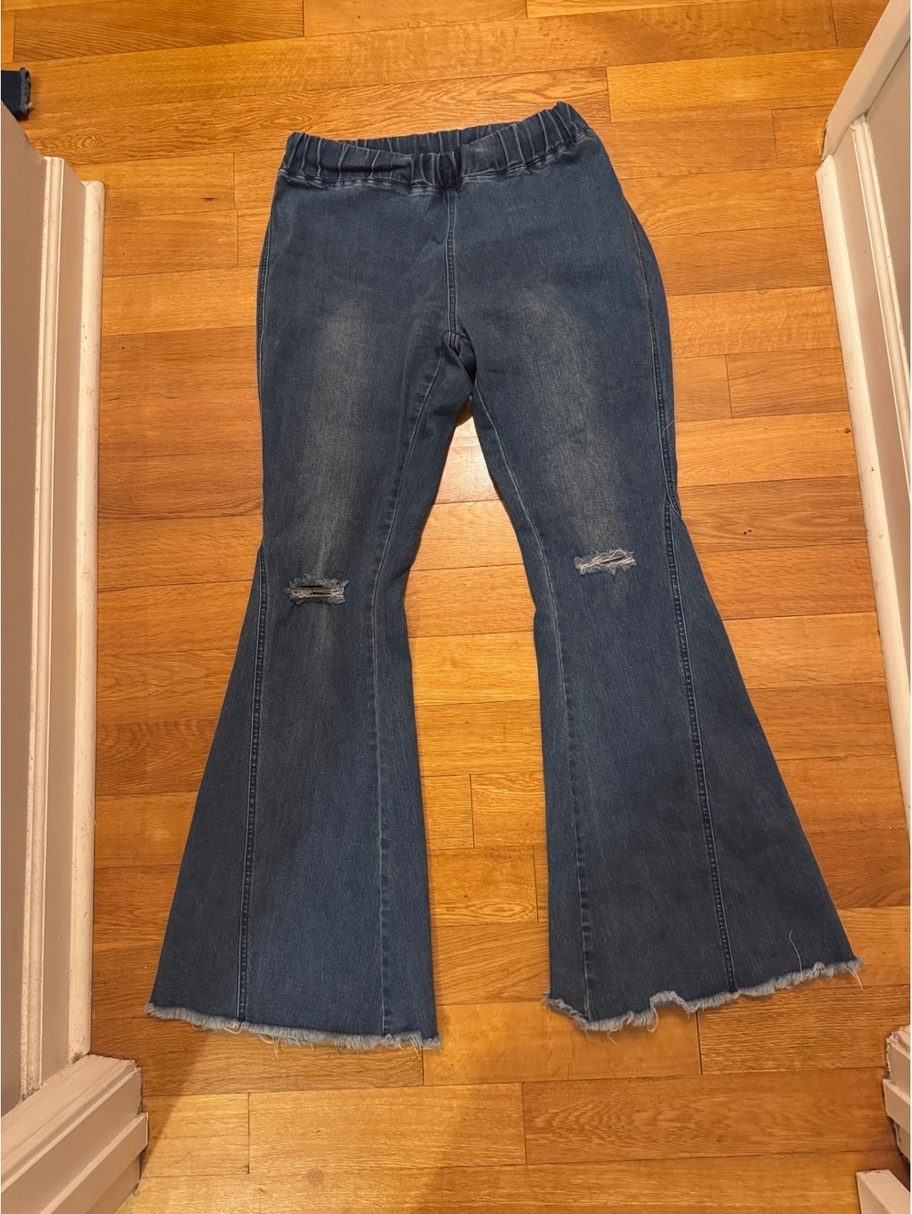 Flared ripped raw edge denim